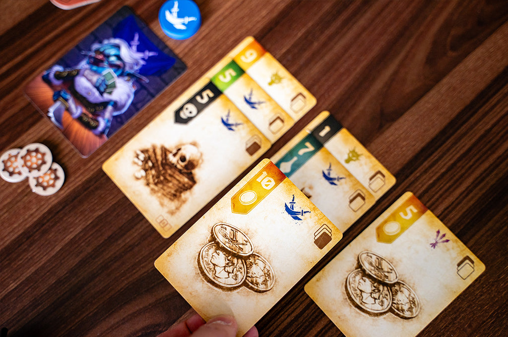 Arranging loot cards to build your vault in Goblin Vaults